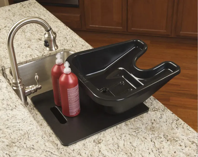 square black bowl with faucet and shampoo